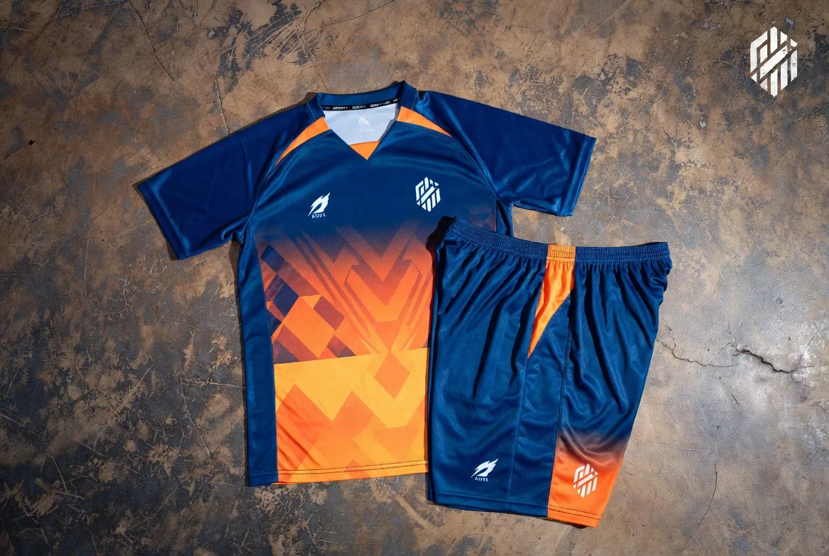 Custom blue to yellow gradient soccer kit with geometric zigzag pattern